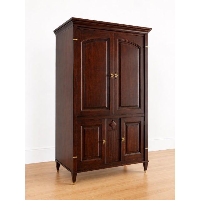 Bring timeless craftsmanship and elegant storage into your home with this beautifully constructed vintage Harden armoire...