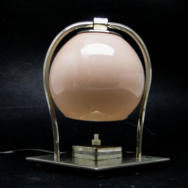 Table lamp made in Germany in the 30s. It was made of metal and glass. It is preserved in good condition, has small traces...