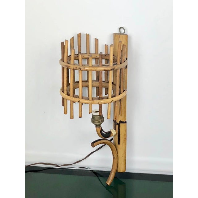 Sconces "Lantern" wall lamp in rattan, attributed to Louis Sognot, France, 1960s. Up to 250V (Europe/UK Standard).The...
