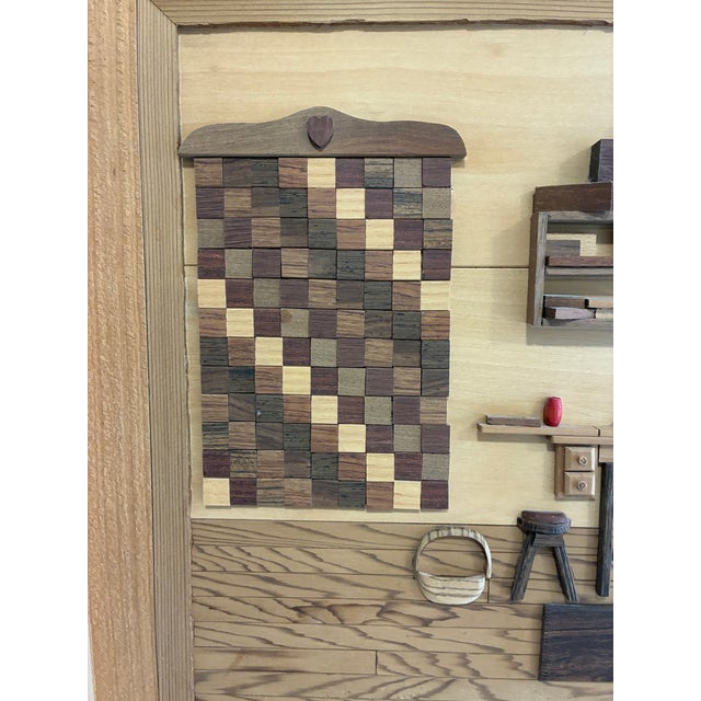 An original handcrafted wood marquetry diorama titled "Grandma's Passion," signed by Cleve Lewis and dated April 1994....