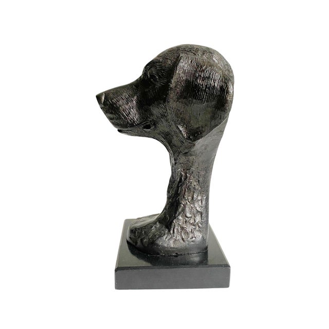Elevate your home decor with this striking Black Metal Dog Bust, expertly crafted to showcase the majestic features of a...
