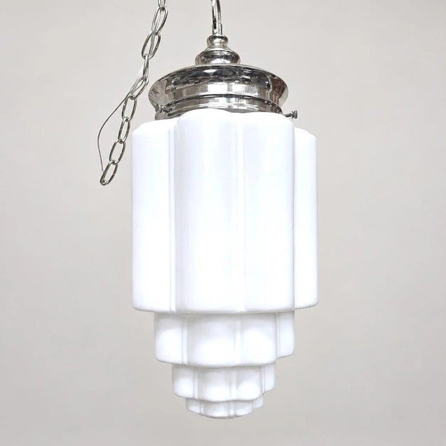 Original vintage skyscraper milk-glass pendant light with new socket, wiring, chain, and hanging hardware. Measures...