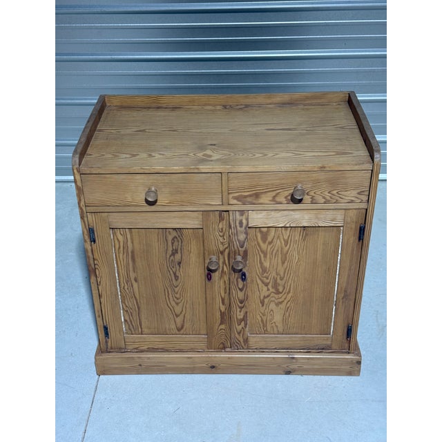 Antique Pine Sideboard / Cupboard From England This sideboard / cupboard has two drawers and a "lip." We found this piece...