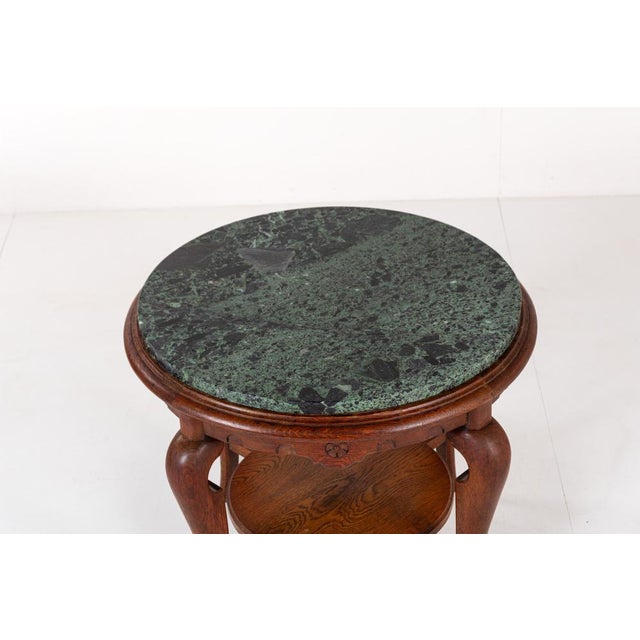 Gorgeous vintage side table with green marble top, standing on elegant curved legs. Because this table stands on four...