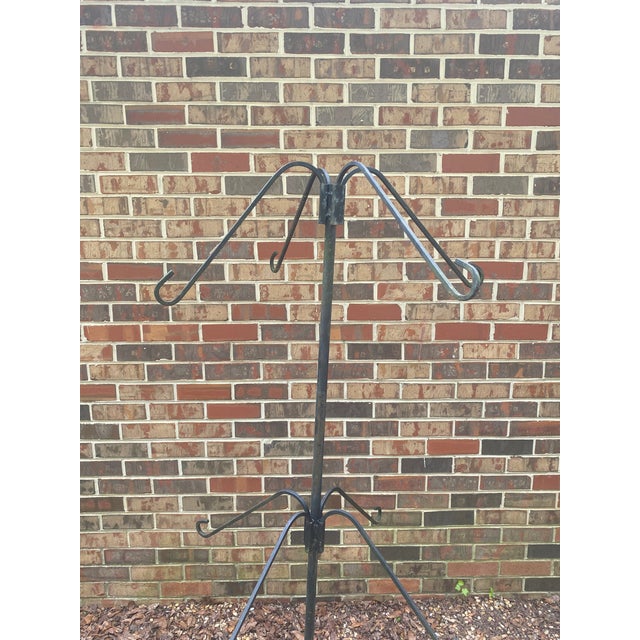 Please excuse the photos showing this item "leaning. The photos were made on unlevel pea gravel -- it stands perfectly...