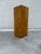 Burl veneer over wood pedestal on a black painted plinth base. There are no manufacturer’s marks on the pedestal.