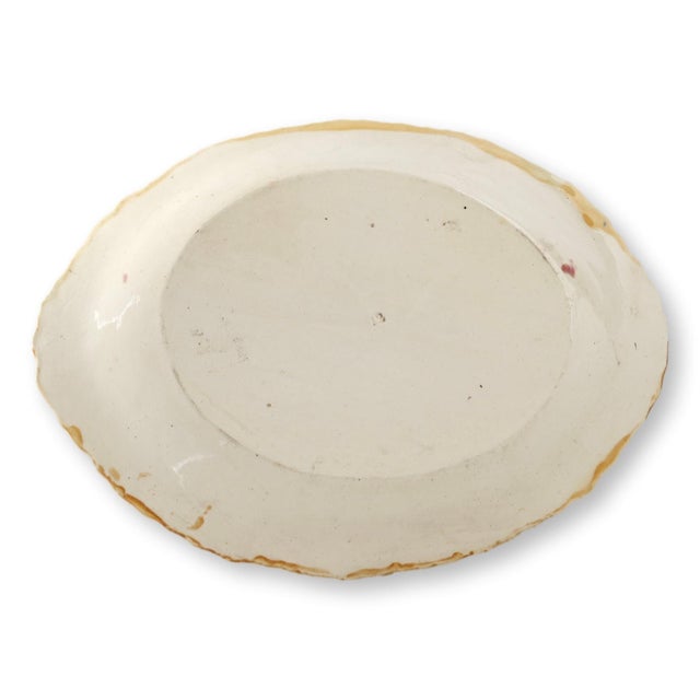 English majolica platter in the classic begonia leaf pattern. Usually found with more pastel coloring, this one is richly...