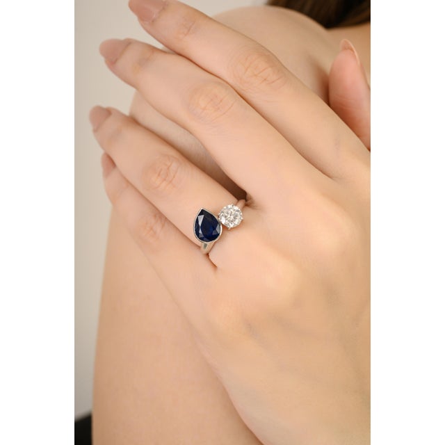 18K White Gold Toi et Moi Ring Ring with 2 Ct Blue Sapphire & 1 Ct Diamond for Women showcases a 2.00 carat oval-cut blue...