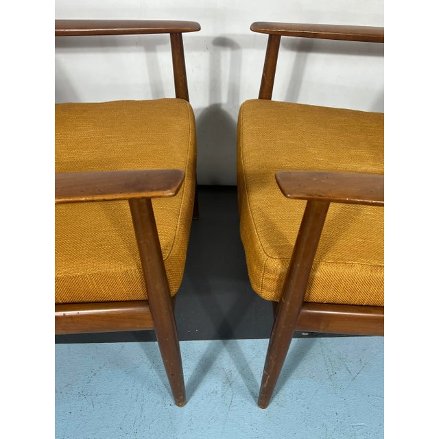 Good vintage condition with trace of age and use for this set of two rosewood armchairs designed by Walter Knoll and...