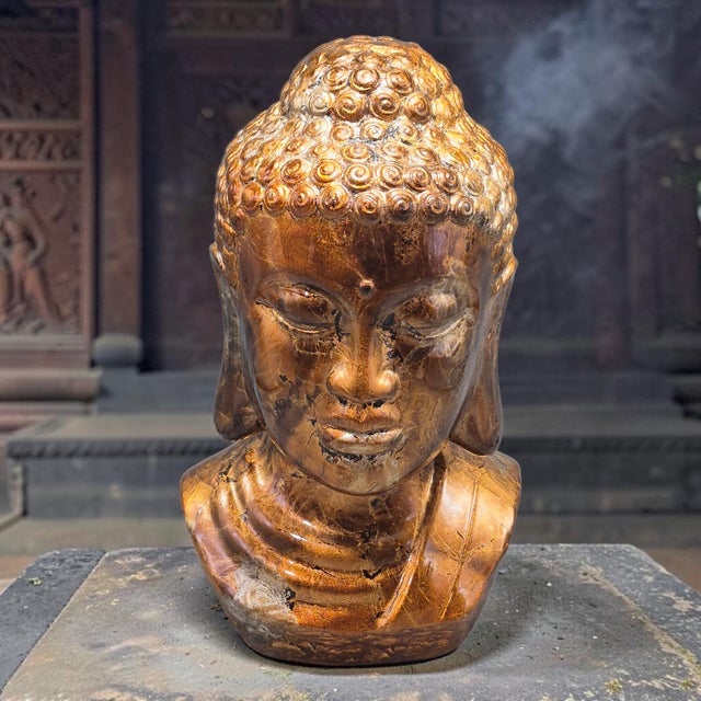 This terra-cotta pottery decorative Buddha head bust stands at 13 inches tall and is intricately painted, making it a...