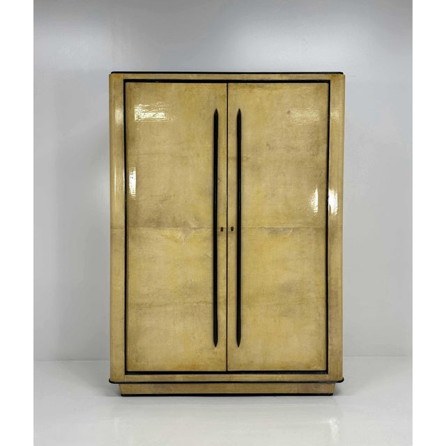 Italian Art Deco Parchment and Walnut Dye Armoire atributed to Guglielmo Ulrich, 1940s, in Restored conditions. Designed...