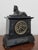 A fine egyptian revival mantel clock retailed by d. Munsey of cambridge, circa 1880s, black marble and slate clock case...