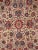 Experience the timeless beauty of this antique Kashan area rug, meticulously handcrafted with 100% wool. The intricate...