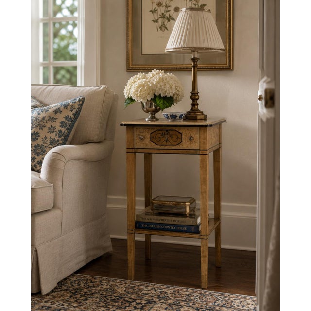 A beautiful Regency style nightstand or side table crafted in bird's eye maple with classical hand-painted details. The...