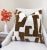 This cocoa and cream pillow cover blends bold pattern with a rich, textured finish. The deep cocoa brown design contrasts...
