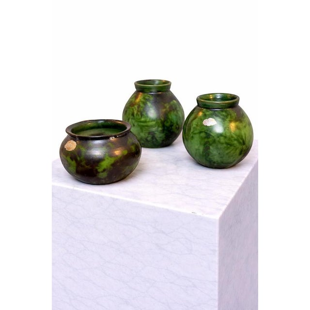 A striking and highly collectible set of three hand-thrown ceramic vessels designed by Erik Mornils for Nittsjö Keramik,...