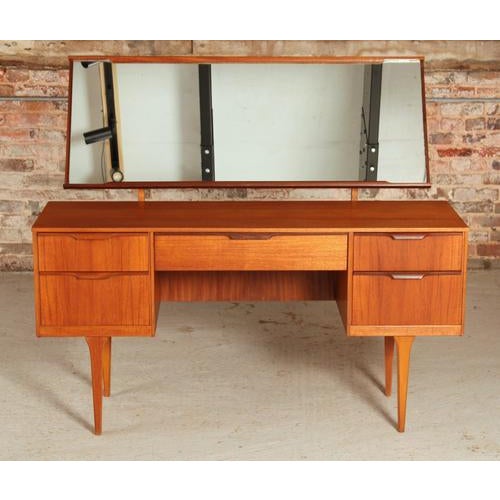 Mid Century teak dressing table by Austinsuite, circa 1960s. 5 drawers with carved teak handles. Excellent restored...