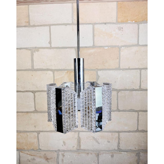 Beautiful, mid-century modernist chandelier, designed by the German company Kaiser Leuchten, dating from the 1960s. This...