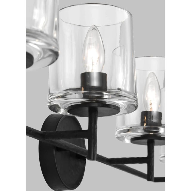 The Marietta four light vanity fixture in Aged Iron embodies Industrial charm with Midcentury flair, the Marietta vanity...