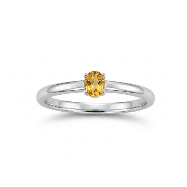 This elegant solitaire piece features a radiant golden gemstone set in a sleek and minimalist design, offering timeless...