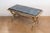 This exquisite 20th-century French coffee table is a stunning blend of opulent materials and elegant design, perfect for...