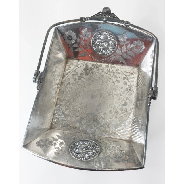 We are selling this great Victorian silverplate cake basket. The basket is made by Meriden CT company Rogers, Smith & Co....