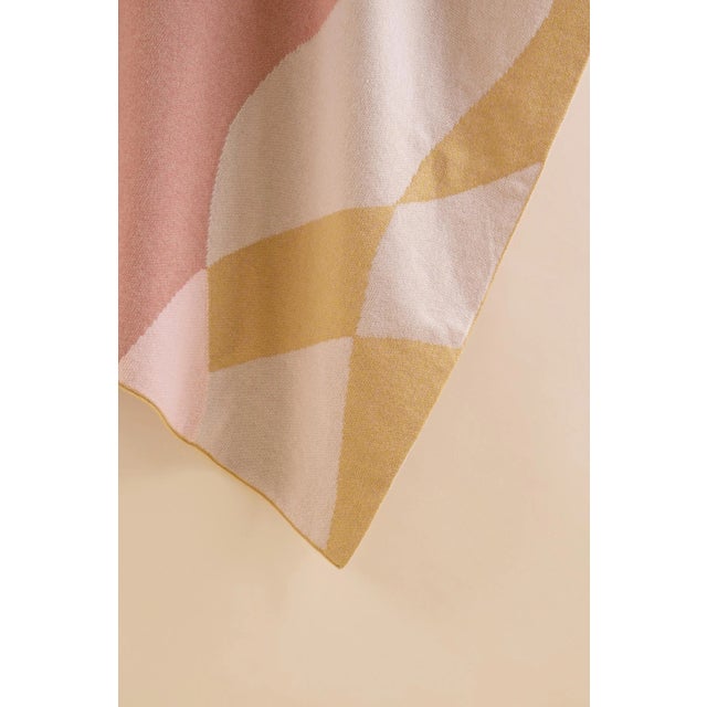 With its abstract design, this sustainable knitted blanket becomes the focal point of any space, adding a colourful and...