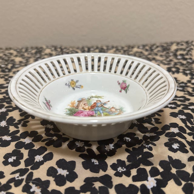 This elegant vintage reticulated porcelain bowl is a classic piece of German craftsmanship, likely from Schumann Bavaria....