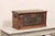 An Indonesian carved teak wood storage box from the early 20th century. This antique wood carved table top chest has a...