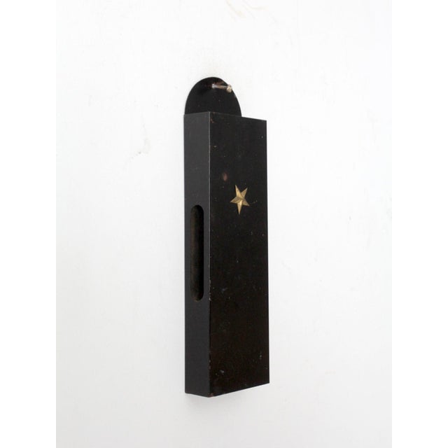 This vintage metal wall mail holder is accented with a brass star and features a tall, streamlined form that keeps letters...
