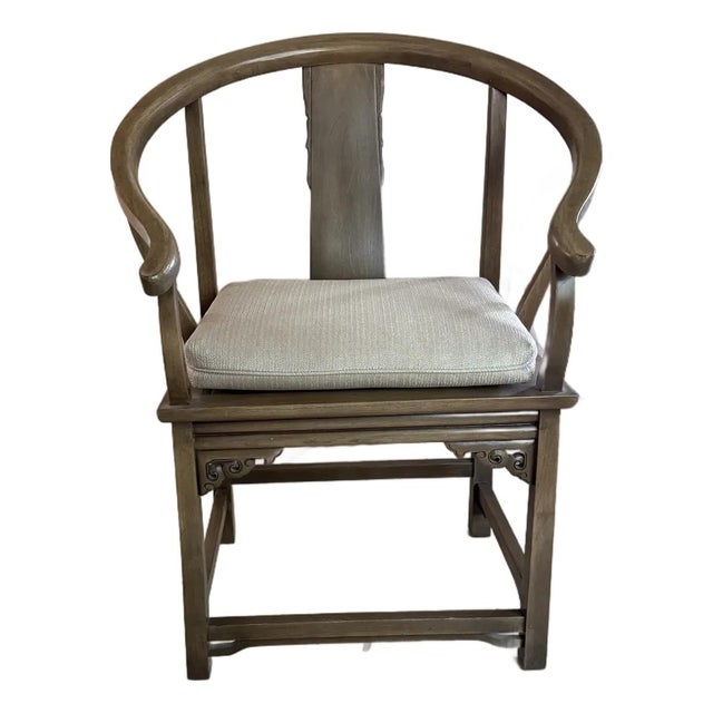 This pair of antique Chinese horseshoe-back armchairs shows the classic quanyi form, in which a single sweeping crest rail...