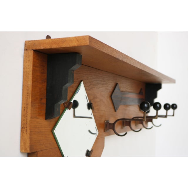 Marvelous Dutch Art Deco Amsterdam school coat / hat rack with beveled mirror. Made from European Oak & black accents and...