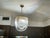Spectacular vintage chandeliers featuring multiple curved clear lucite ribbons suspended from brass tone frame. These are...
