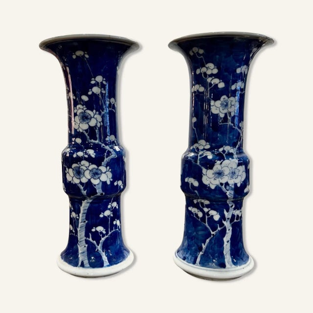 Pair of Late 19th Century Gu Form Chinese Export Porcelain Blue and White Vases. The pattern is prunus-blossom on a...