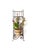 This vintage wrought iron wall planter features scrolling ironwork, a weathered white painted finish, and a small floral...