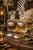 A pristine set of four silverplate decanter tags made by Godinger exclusively for The Bombay Company. Each tag features a...