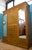 A substantial Edwardian compactum wardrobe by Simpson & Sons Ltd of Halifax & Blackburn, finished in mahogany veneers with...