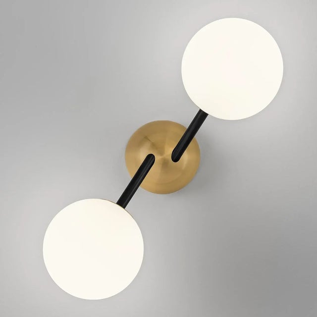 A Striking Wall Light With Asymmetric Arms To Give A Random Look With Warm Led Light Within The Matt Opal Glass Globes...