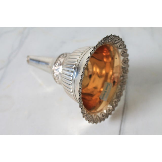 Vintage silver-plated wine funnel and aerator, featuring an ornate Tudor rose pattern. No maker mark. Age wear to finish.
