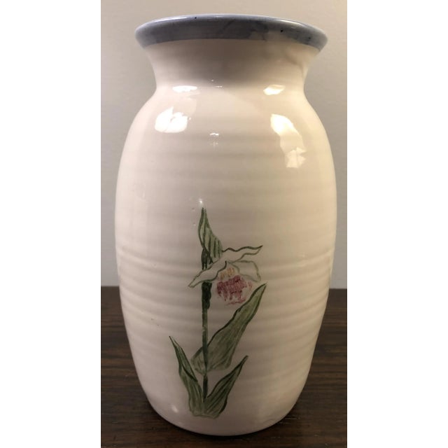 Very nice studio pottery vase with painted flowers, artist signed.