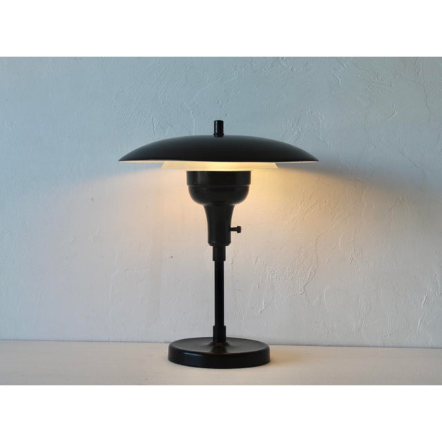 Paulson Style Mid Century Flying Saucer Desk Lamp in Black. Two piece construction. In good vintage condition with some...