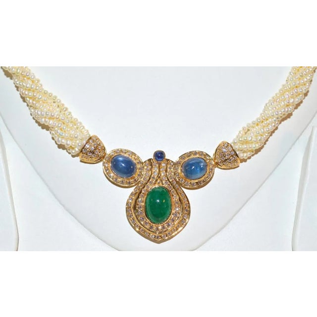 Certified natural 18K solid gold 141.37CTS diamond, sapphire, pearl and emerald necklace. This necklace is loaded with...