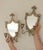 Two elegant double arm Italian candle wall sconces with mirrors, adorned with scroll detailing. These sconces are in good...