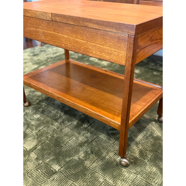 A rare mid century modern 2 tier bar or serving cart, influenced by the clean, functional lines of Hans Jørgen Wegner and...