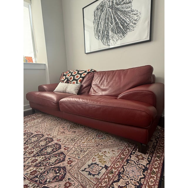 High-quality designer sofa made in Italy with genuine natural leather in a beautiful oxblood/rust color. Roche Bobois is a...