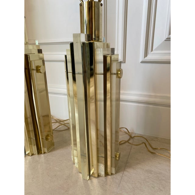 Incredibly heavy, top quality vintage brass and solid matte acrylic Art Deco Cityscape table lamps. Elegant and...
