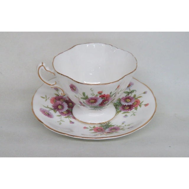 This lovely tea cup and saucer set is made of bone china, and it is stamped as being made by Hammersley in England, see...