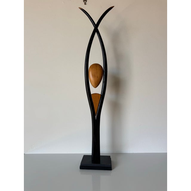 Striking 20th century modernist sculpture by listed artist Wayne Pelham, carved in wood with a bold abstract form. The...