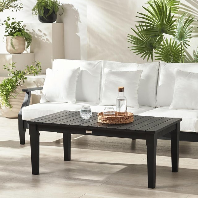 Transform your outdoor space with the Martinique wood patio coffee table in black. This striking piece blends seamlessly...