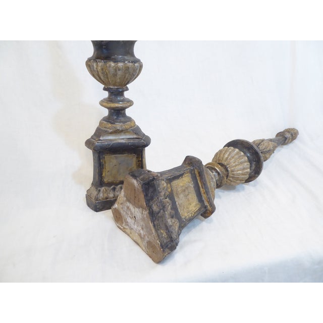 This pair of Italian silverleafed candlesticks with a triangular base, are 32.25"H and 7" wide